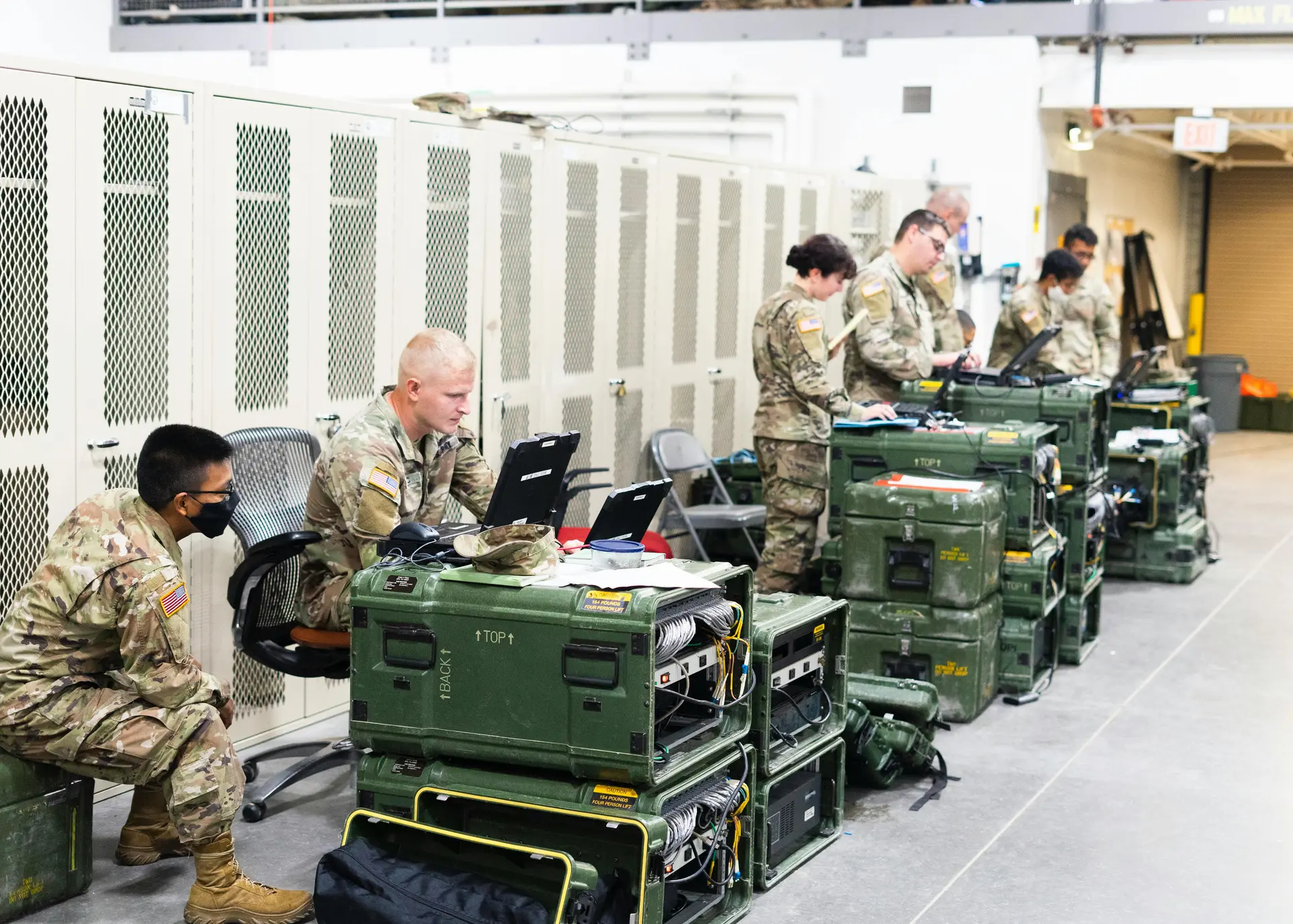 Military personnel preparing battlefield IT