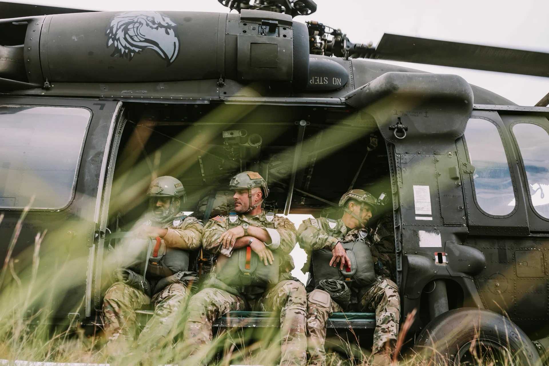 Special operations unit ready to jump out of helicopter after discussing mission details with battle field LLM